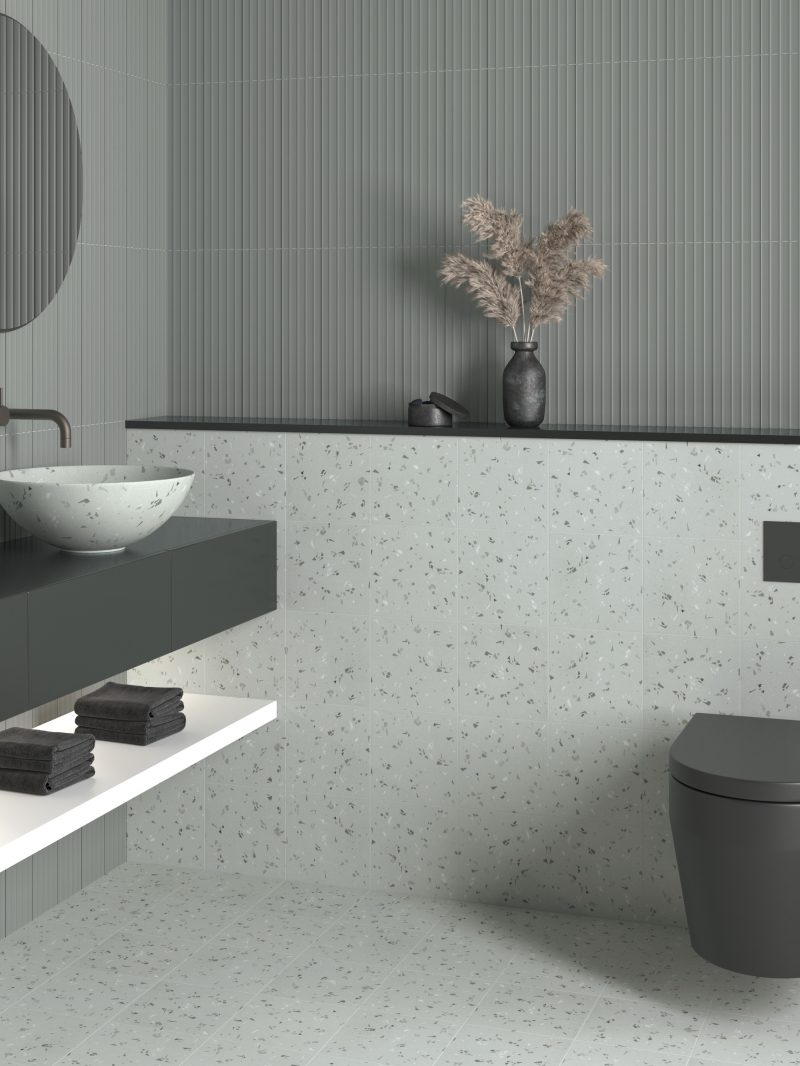 Värviline terrazzo-mustriga keraamiline plaat Dune Fragmenta Gris – interjöör
