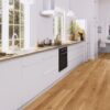 Wooden floor Bauwerk Casapark Oak 46 bavelled, brushed and matt lacquered installed on kitchen floor. Kitchen furniture, dining table.